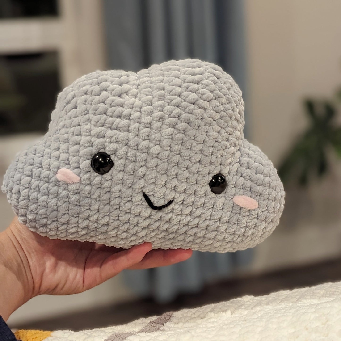 cute soft gray crochet cloud with happy face, stuffed animal plushie toy handmade with yarn
