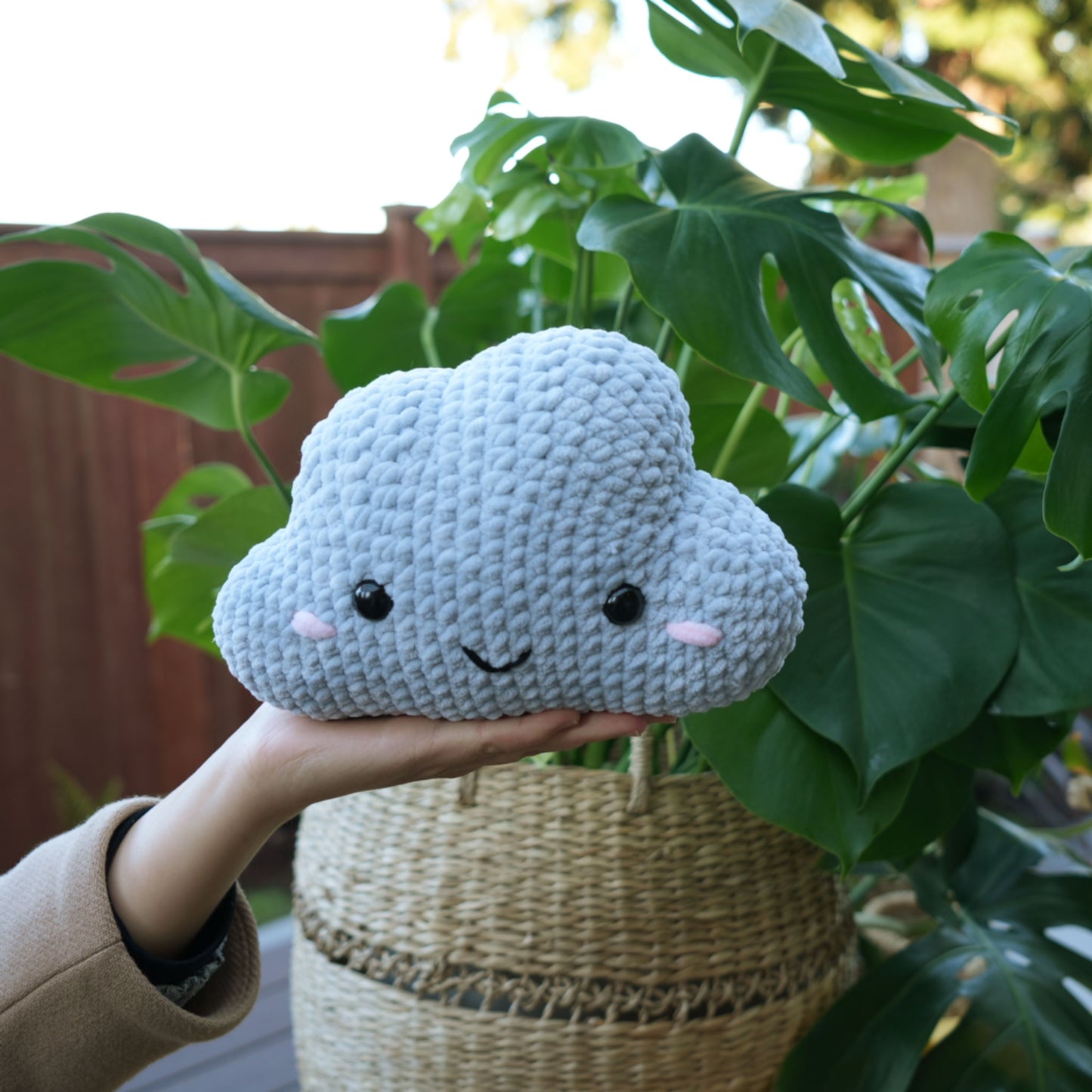 cute soft gray crochet cloud with happy face, stuffed animal plushie toy handmade with yarn