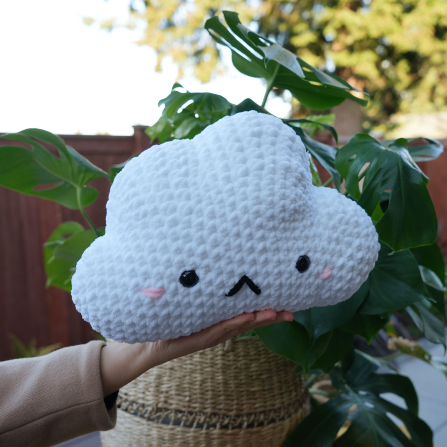 cute soft white crochet cloud with sad face, stuffed animal plushie toy handmade with yarn pillow