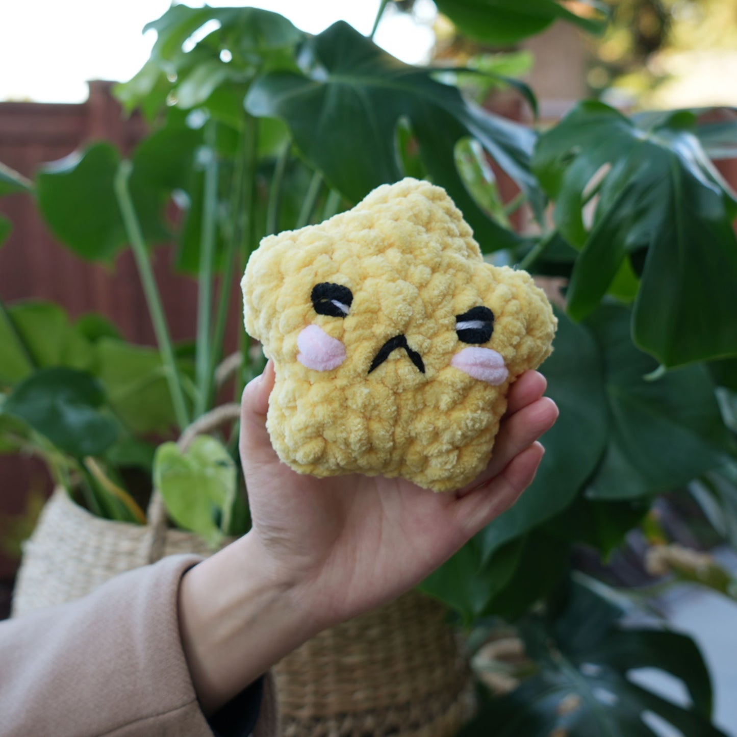cute soft yellow crochet star with happy face, stuffed animal plushie toy handmade with yarn