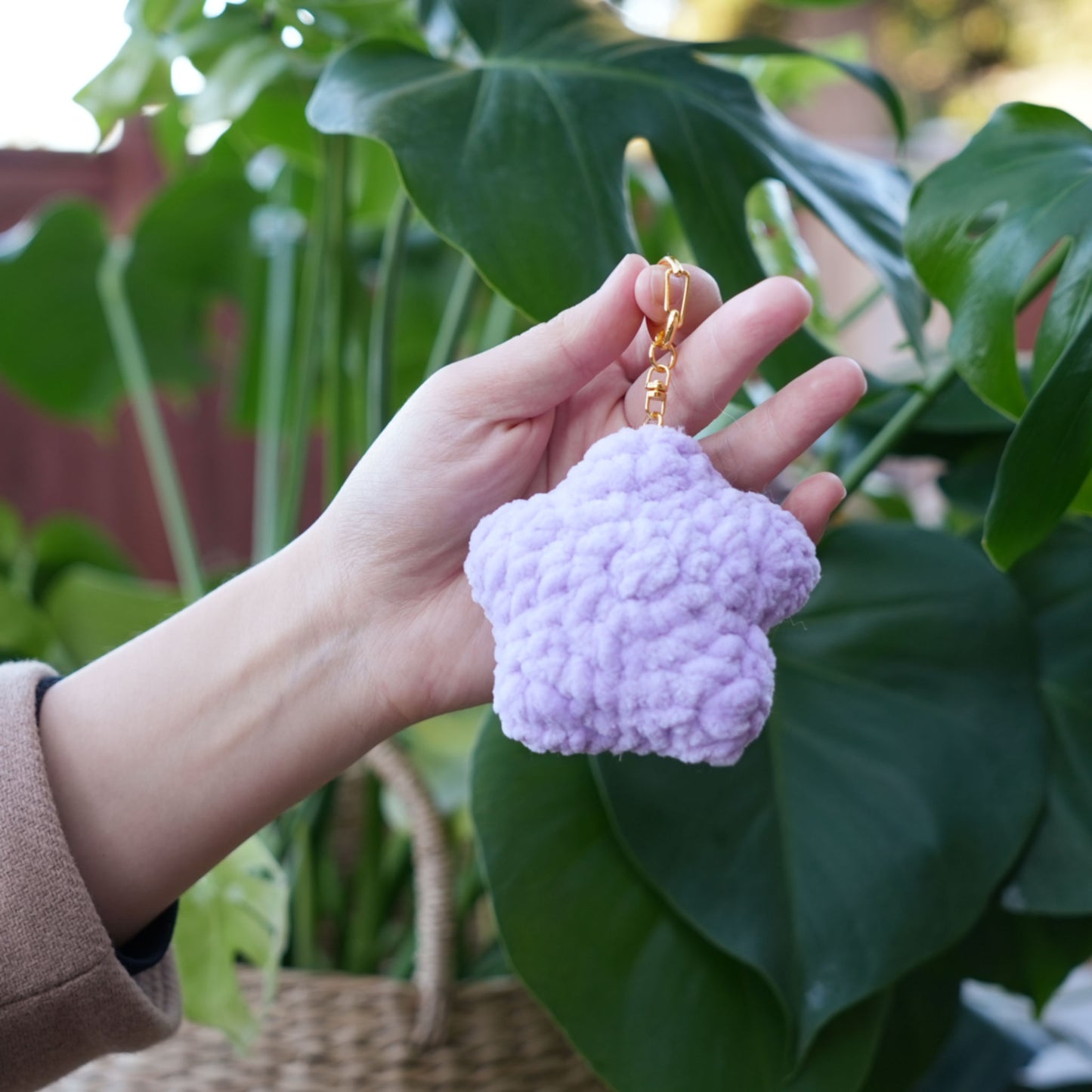 cute soft purple crochet star with happy face, stuffed animal plushie toy handmade with yarn keychain