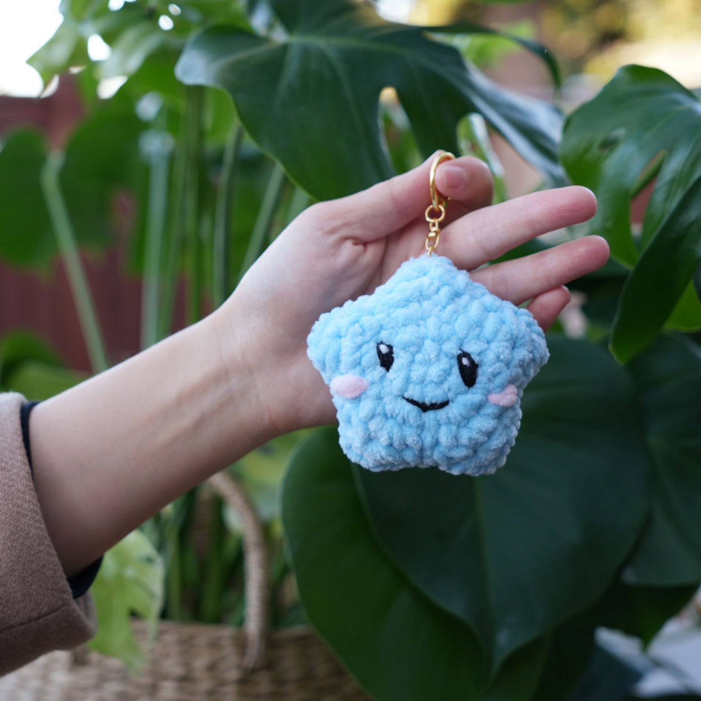 cute soft blue crochet star with happy face, stuffed animal plushie toy handmade with yarn keychain