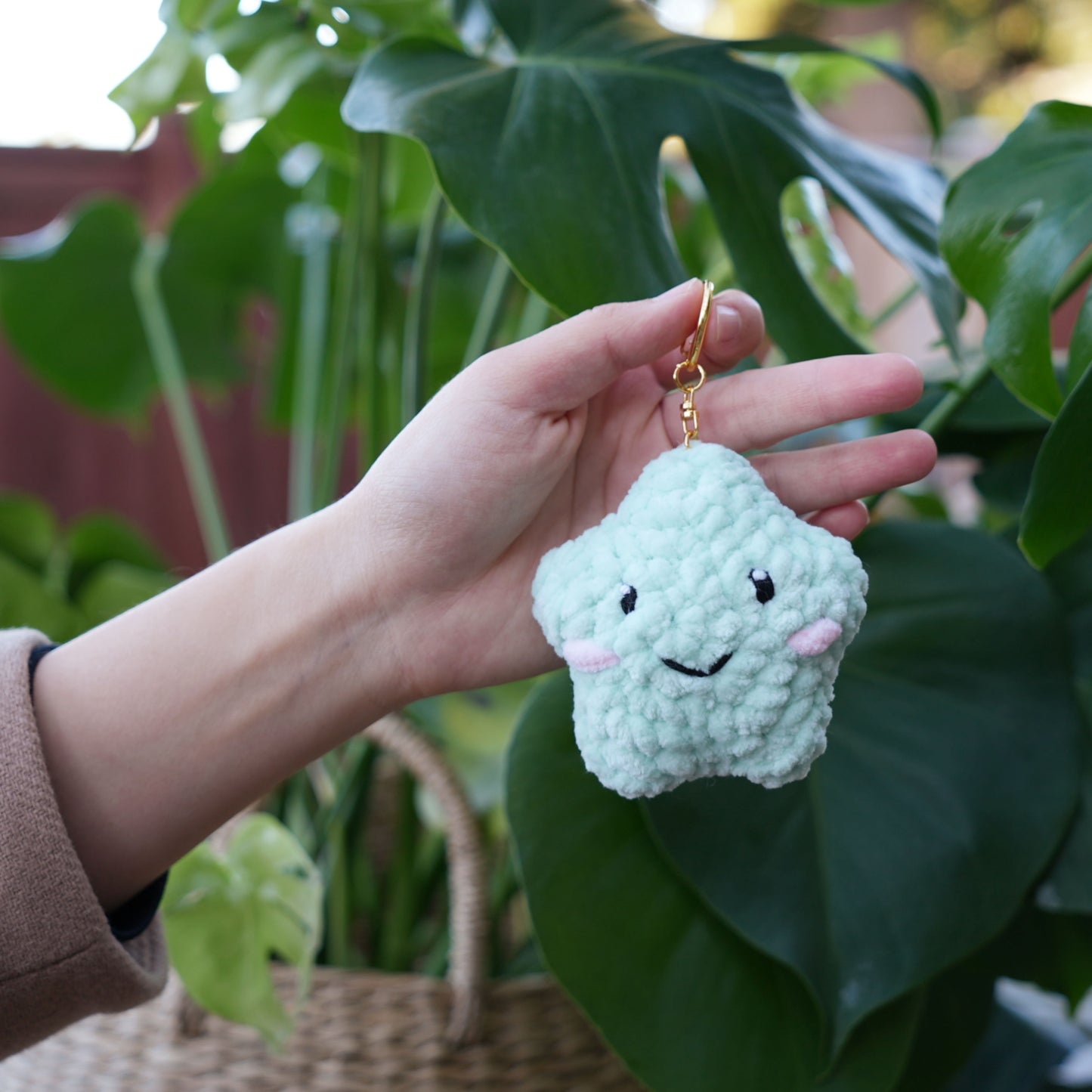 cute soft green crochet star with happy face, stuffed animal plushie toy handmade with yarn keychain