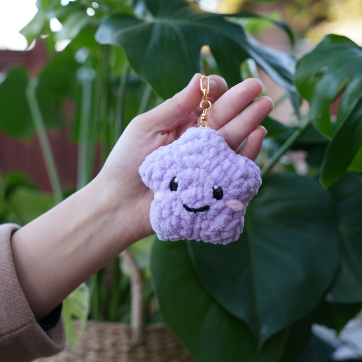 cute soft purple crochet star with happy face, stuffed animal plushie toy handmade with yarn keychain